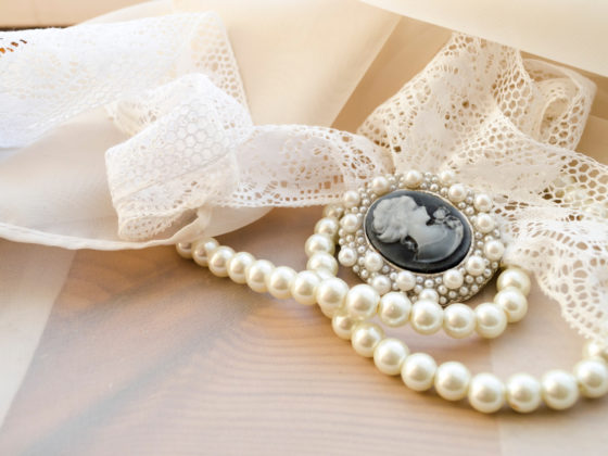 Pearls and cameo on an antique jewelry display