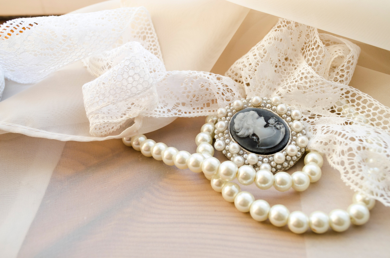 Pearls and cameo on an antique jewelry display